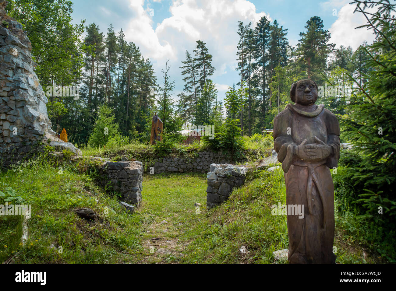 Slovak Paradise, Letanovce / Slovakia - June, 19, 2018:  wooden statue of a monk in the ruins of the Klastorisko monastery in the Slovak Paradise Nati Stock Photo