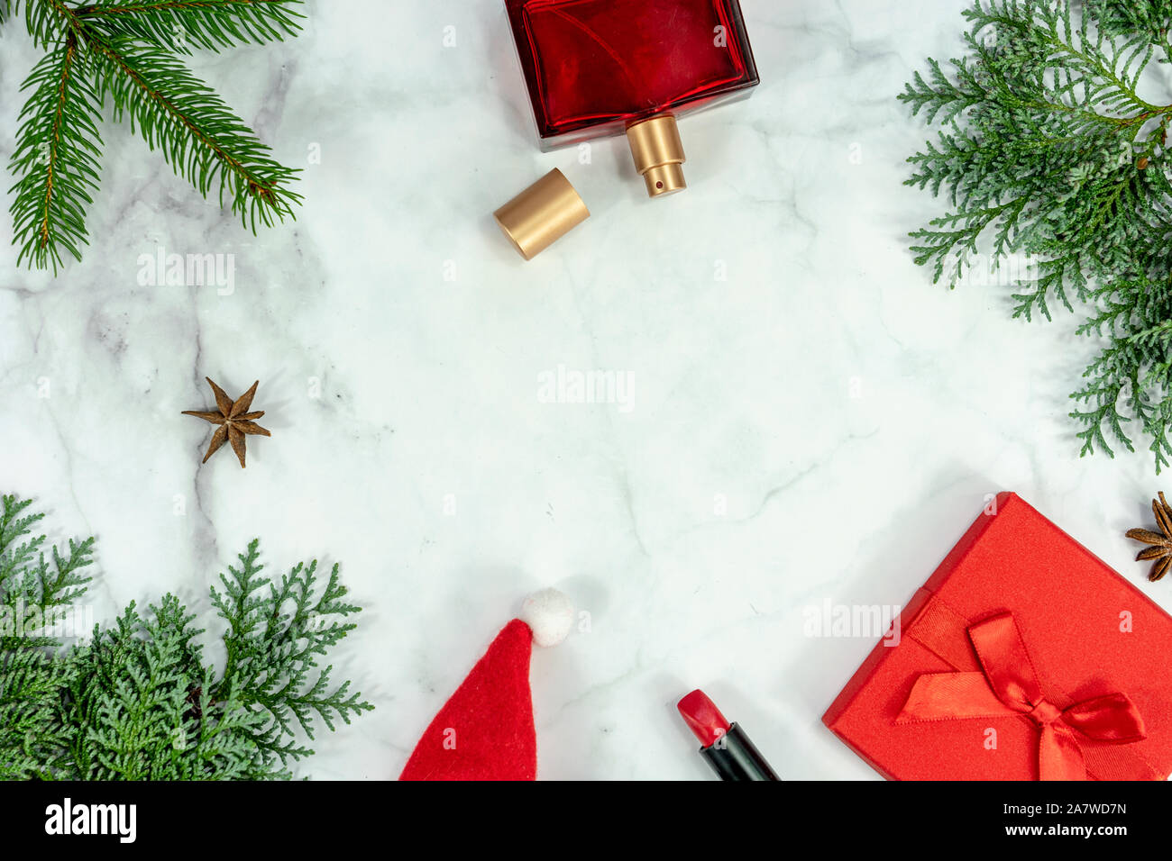 Christmas frame background flat lay on marbel with decoration gift box perfume and lipstick . Stock Photo