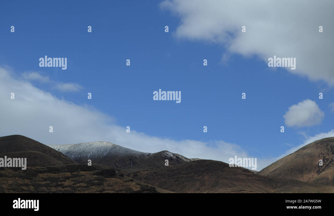 Late Spring in Nevada: Blue Sky Over Snow-Dusted Pah Rah Range Stock Photo