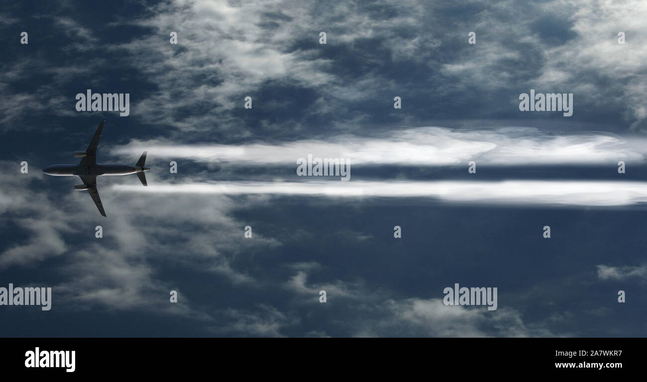 passenger plane is flying above the clouds Stock Photo - Alamy