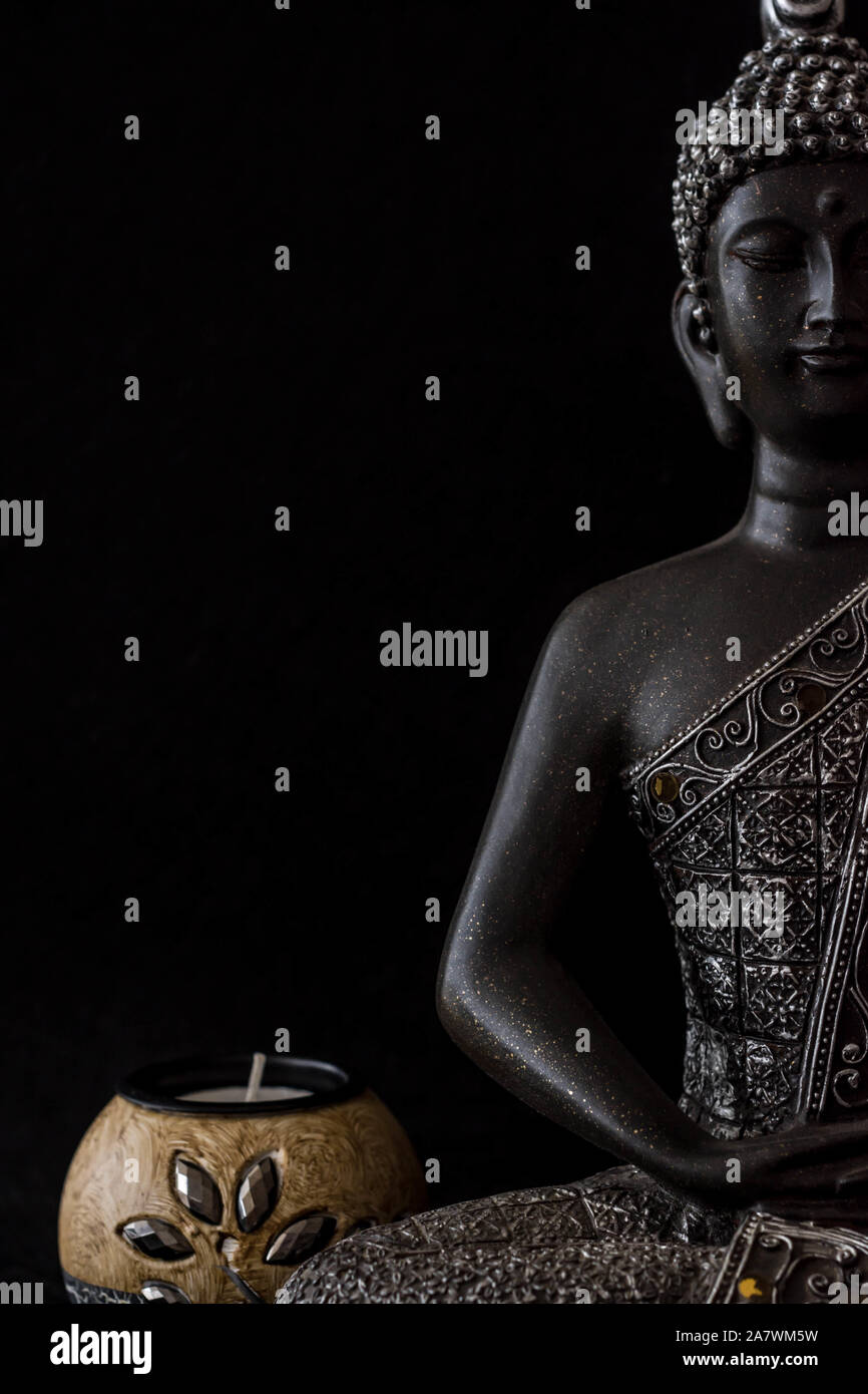 budha figure on black background Stock Photo