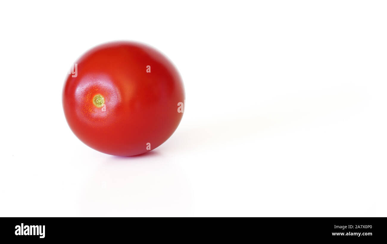 Small red cherry tomato isolated on white background, space for text right side Stock Photo