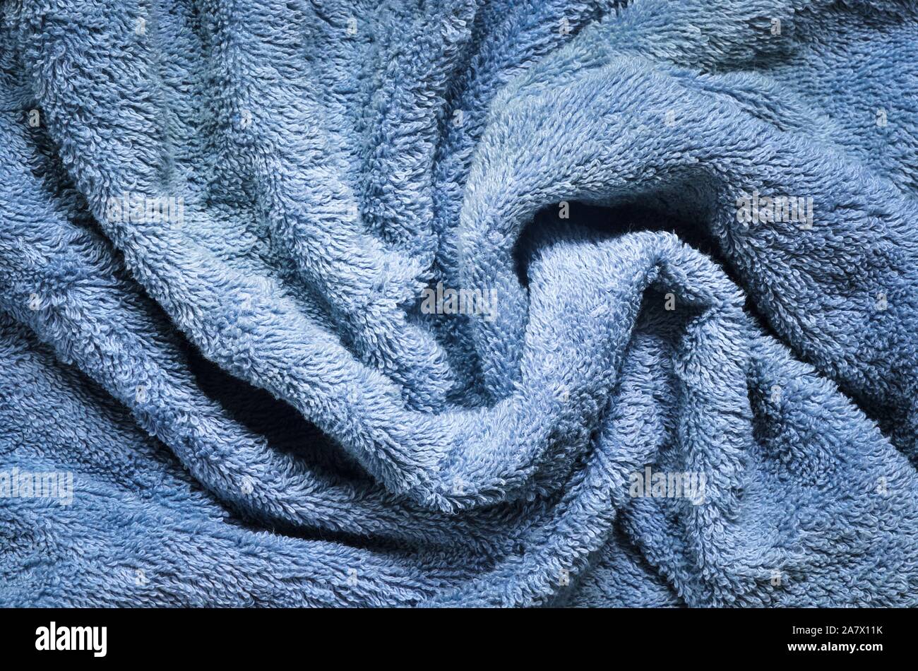 Background made of fluffy material. Texture of a wrinkled towel Stock