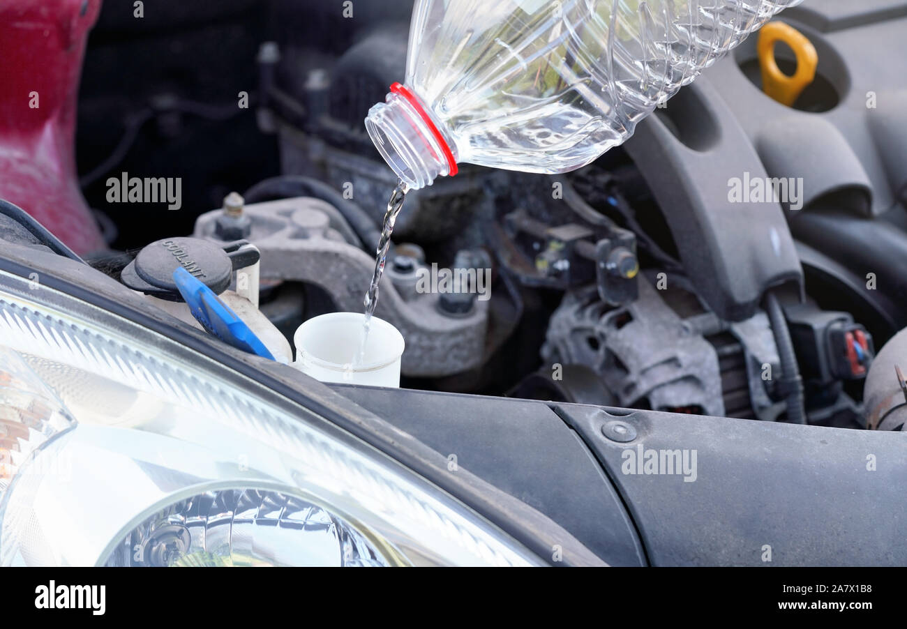 Pouring distilled water ecological alternative to washing fluid to