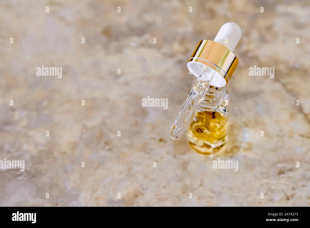 Pipette and bottle of serum Stock Photo Alamy
