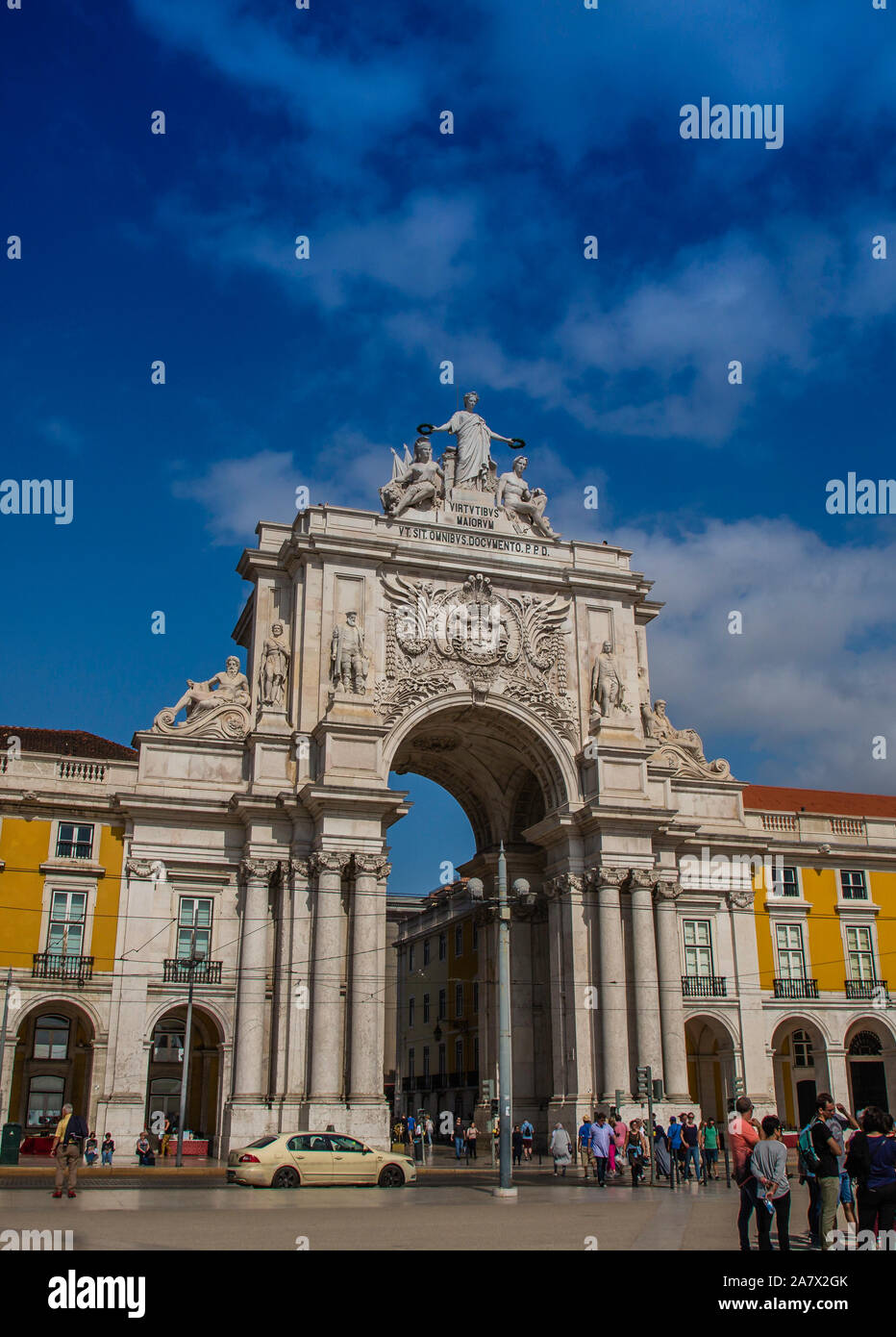 Lisbon (Lisboa, Portugal's Arch of Triumph against a dramatic blue sky that accents its bright stone and dominating presence in Praca do Comercio. Stock Photo