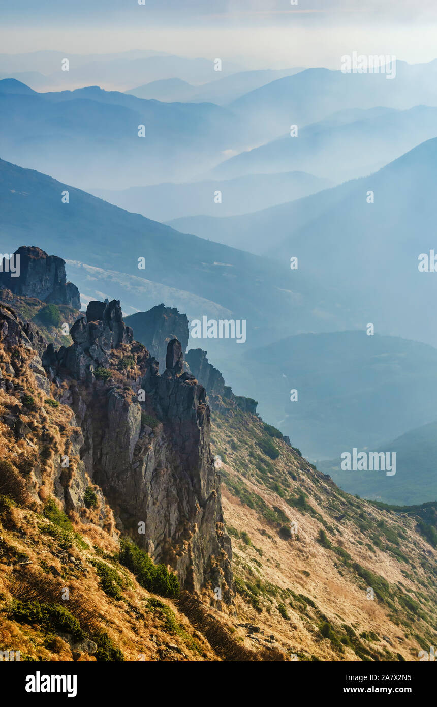 Amazing view from Chornogora ridge, Ukraine. Sharp rocks of Spytsi mountain and blue mountain valleys. Stock Photo