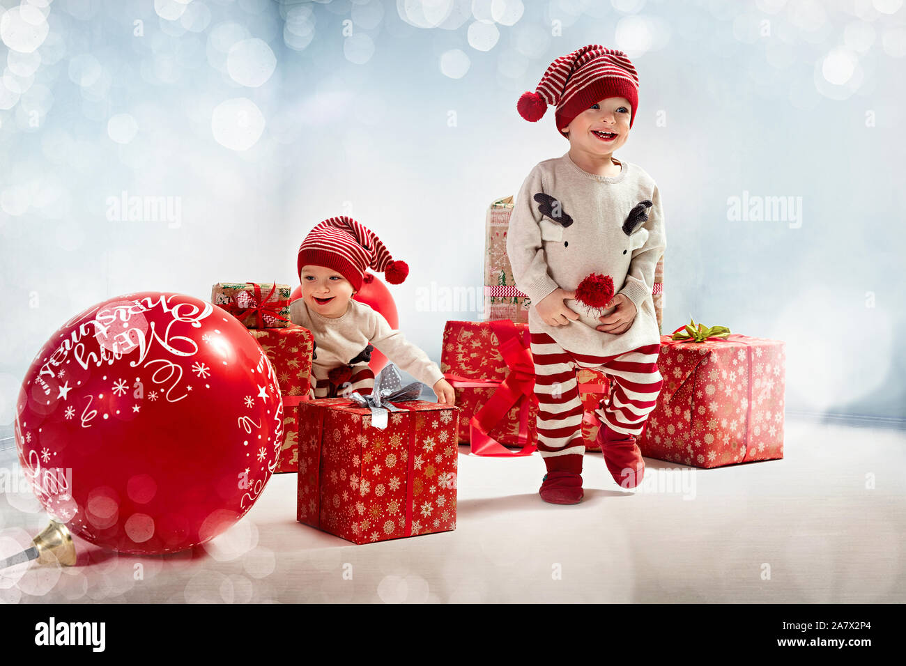 Two cheerful brothers enjoying the Christmas time Stock Photo