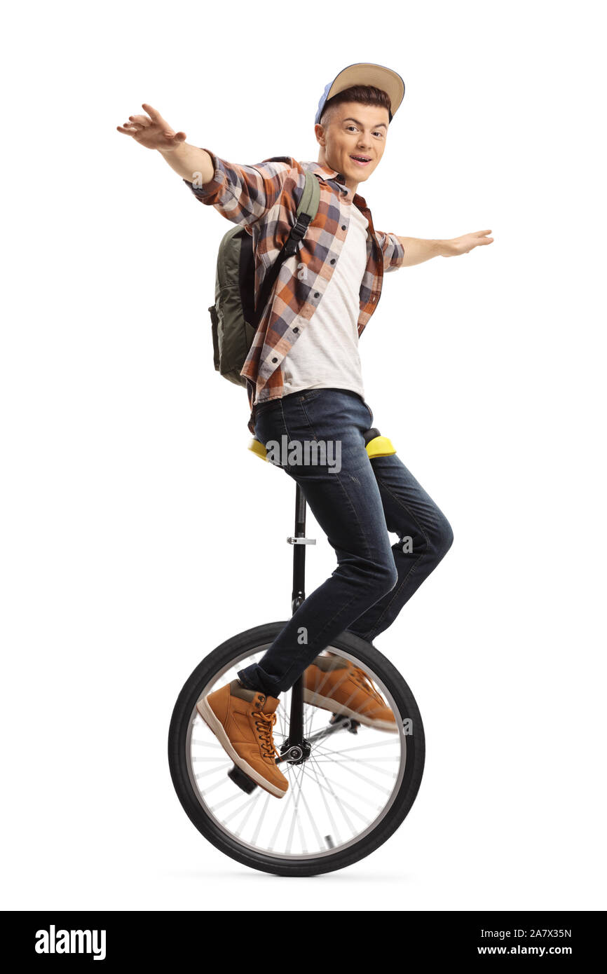Excited male student riding a unicycle isolated on white background Stock Photo