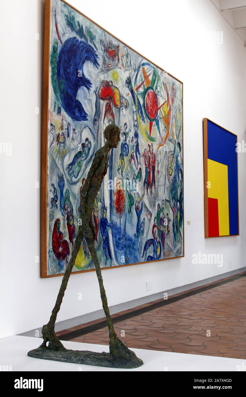 Sculpture by Giacometti with painting by Chagall at the Maeght Foundation, Cote d'Azur, France Stock Photo