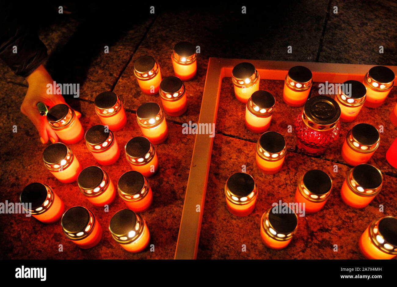 People light candles in memory of anticorruption activist Kateryna