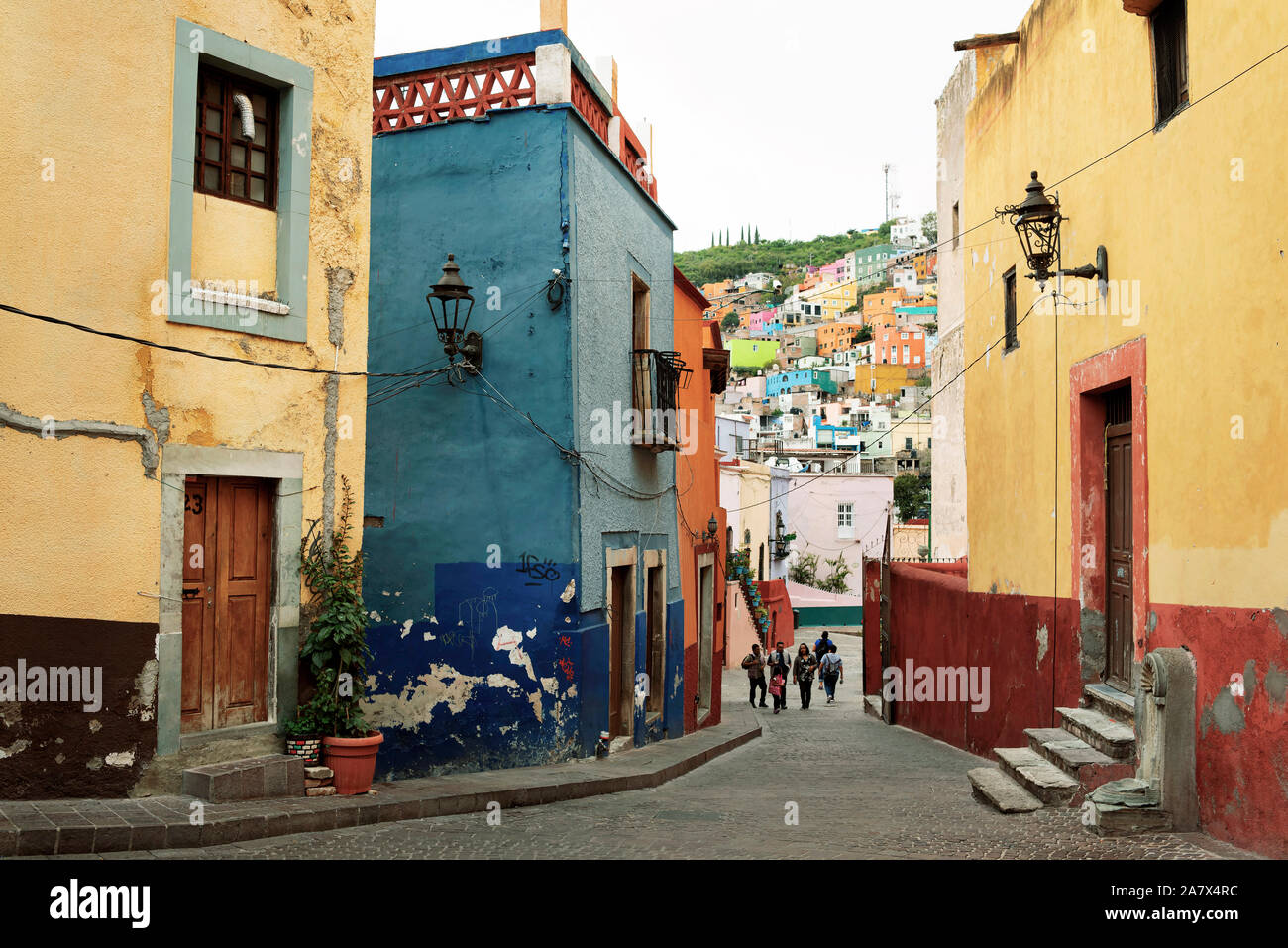 Beautiful street view of colourful houses on Roque Street, in the historic centre of Guanajuato city, Mexico. Jun 2019 Stock Photo