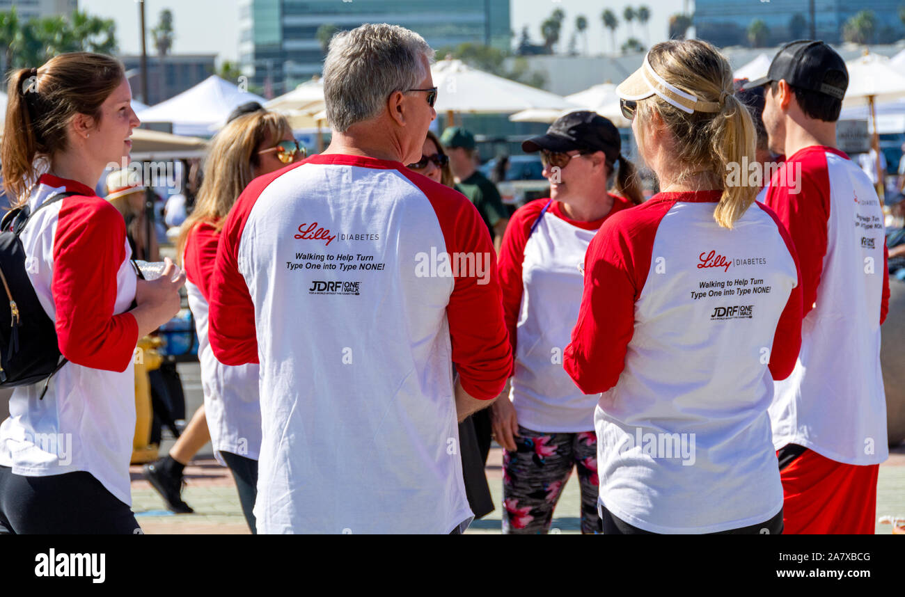 Anaheim, CA / USA - Nov 3, 2019: Volunteers talking together at the 2019 JDRF One Walk fundraiser for Juvenile Diabetes. Stock Photo