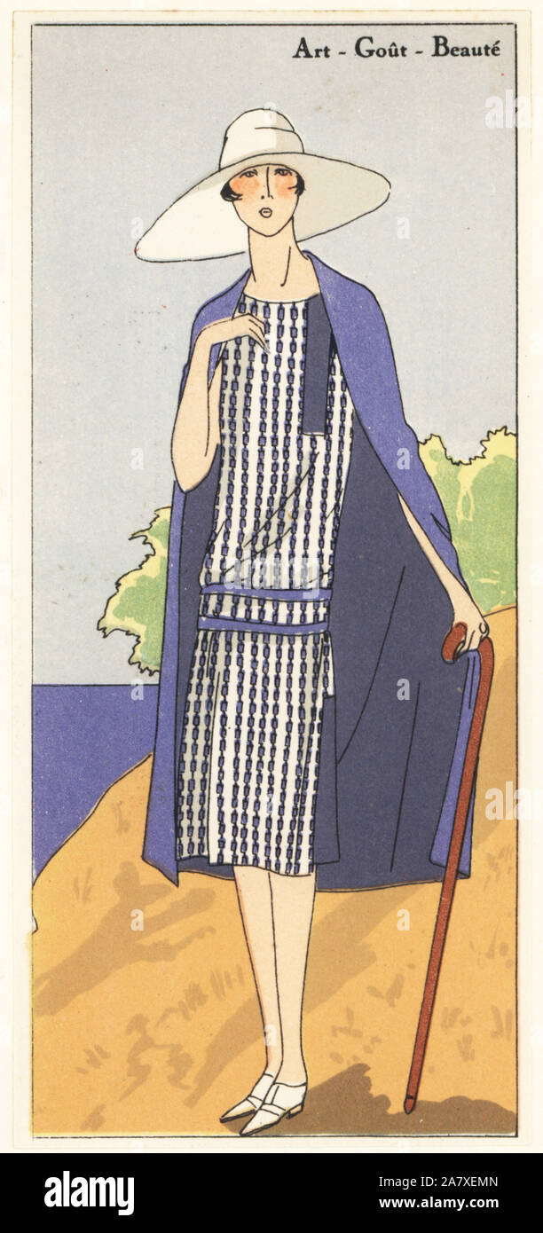 Woman in ensemble of white printed crepe dress and cape in the same blue. Handcolored pochoir (stencil) lithograph from the French luxury fashion magazine Art, Gout, Beaute, 1926. Stock Photo