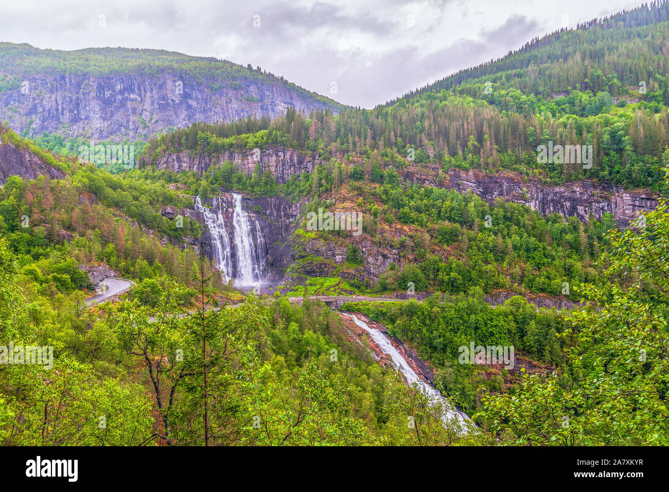 View of Skjervsfossen waterfall located along the National Tourist Routes on a rainy summer day. Norway Stock Photo