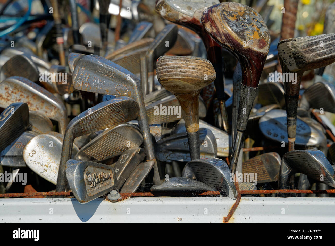 Where old golf clubs retire. A bin of discarded golf clubs at a recycle