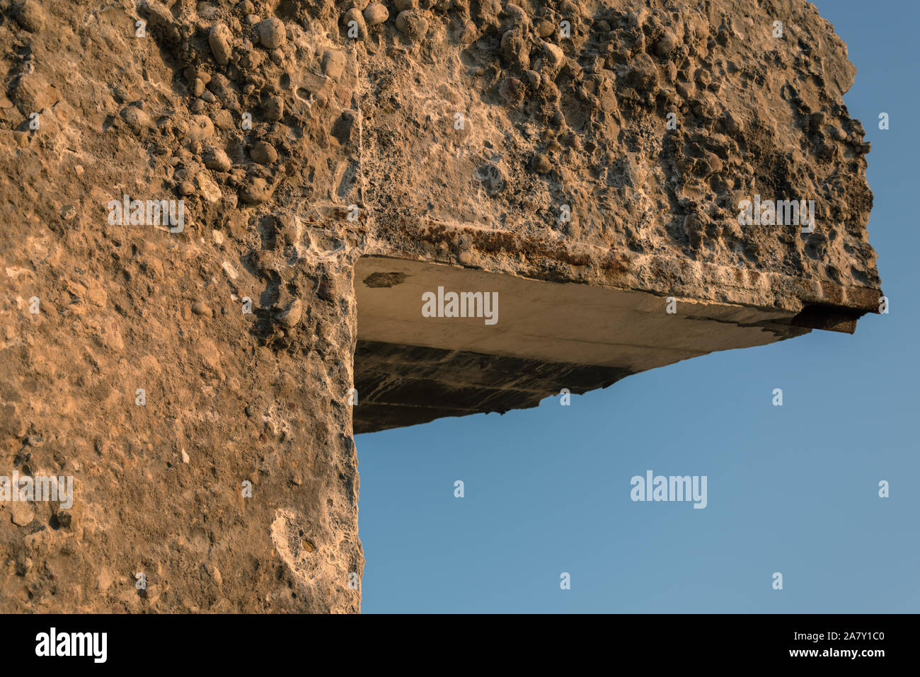 Wall of abandoned ruined house on blue sky background Stock Photo - Alamy