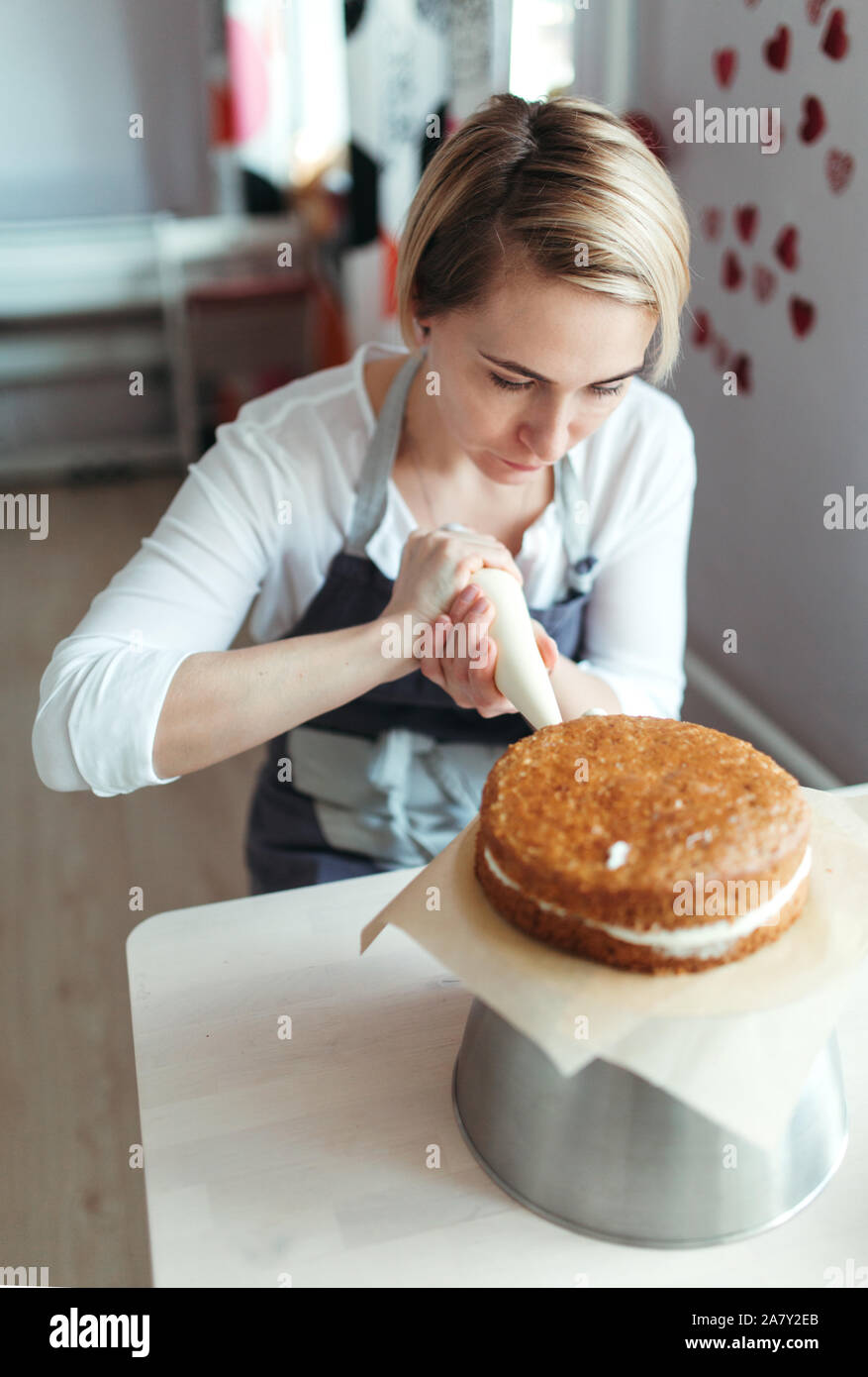 A middle aged woman confectioner or baker. Stock Photo