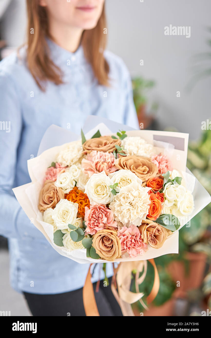 White And Peach Color Beautiful Bouquet Of Mixed Flowers In Womans Hands The Work Of The Florist At A Flower Shop Fresh Cut Flower Stock Photo Alamy