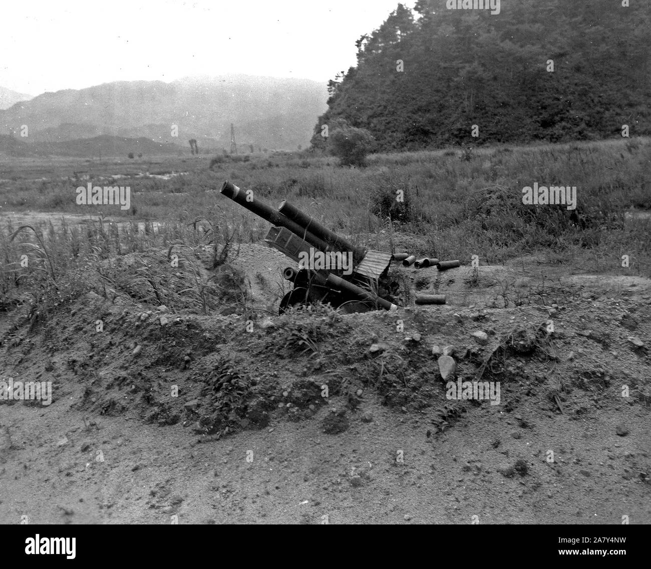 Decoy Artillery. Republic of Korea (ROK) troops in the 25th US Infantry Division Sector in Korea set up this wooden 105 MM Howitzer as part of a decoyed line of fire to throw enemy fire-power off guard ca. 8/1951 Stock Photo
