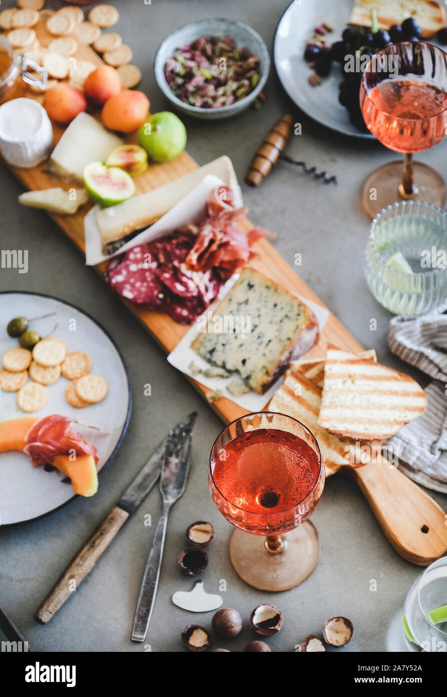 Midsummer picnic with rose wine, cheese, charcuterie, appetizers and