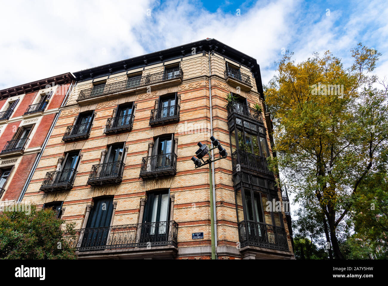 Old luxury residential buildings with balconies and enclosed balconies in  Salamanca district in Madrid Stock Photo - Alamy