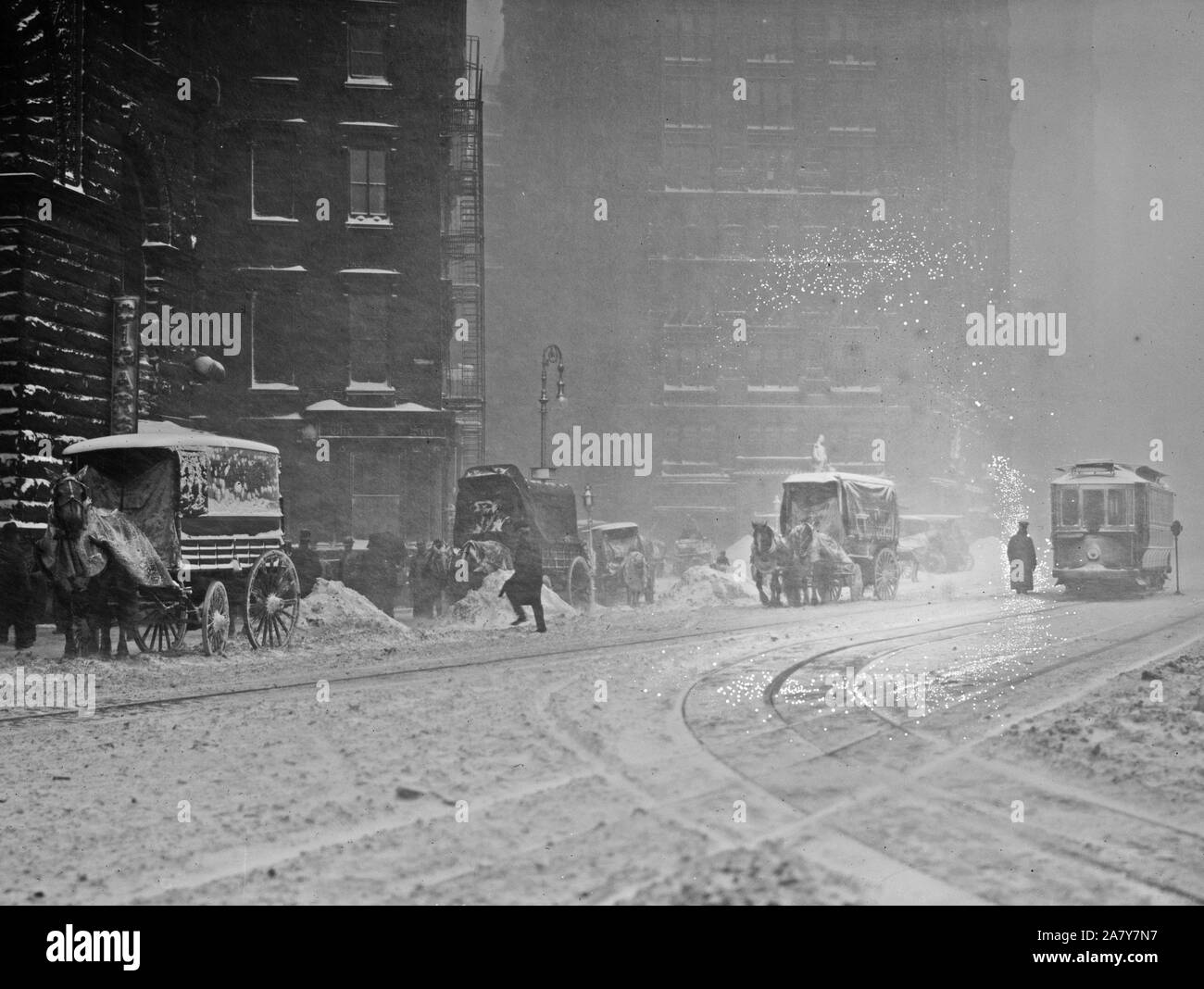 January 1913 snowstorm street scene in New York City, NY Stock Photo