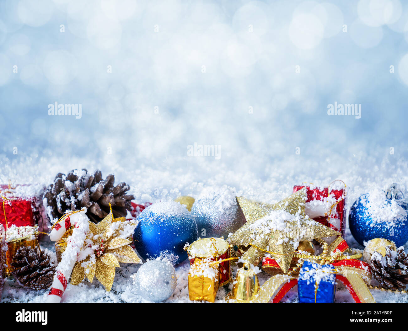 Snowy Christmas background with baubles. New year concept Stock Photo