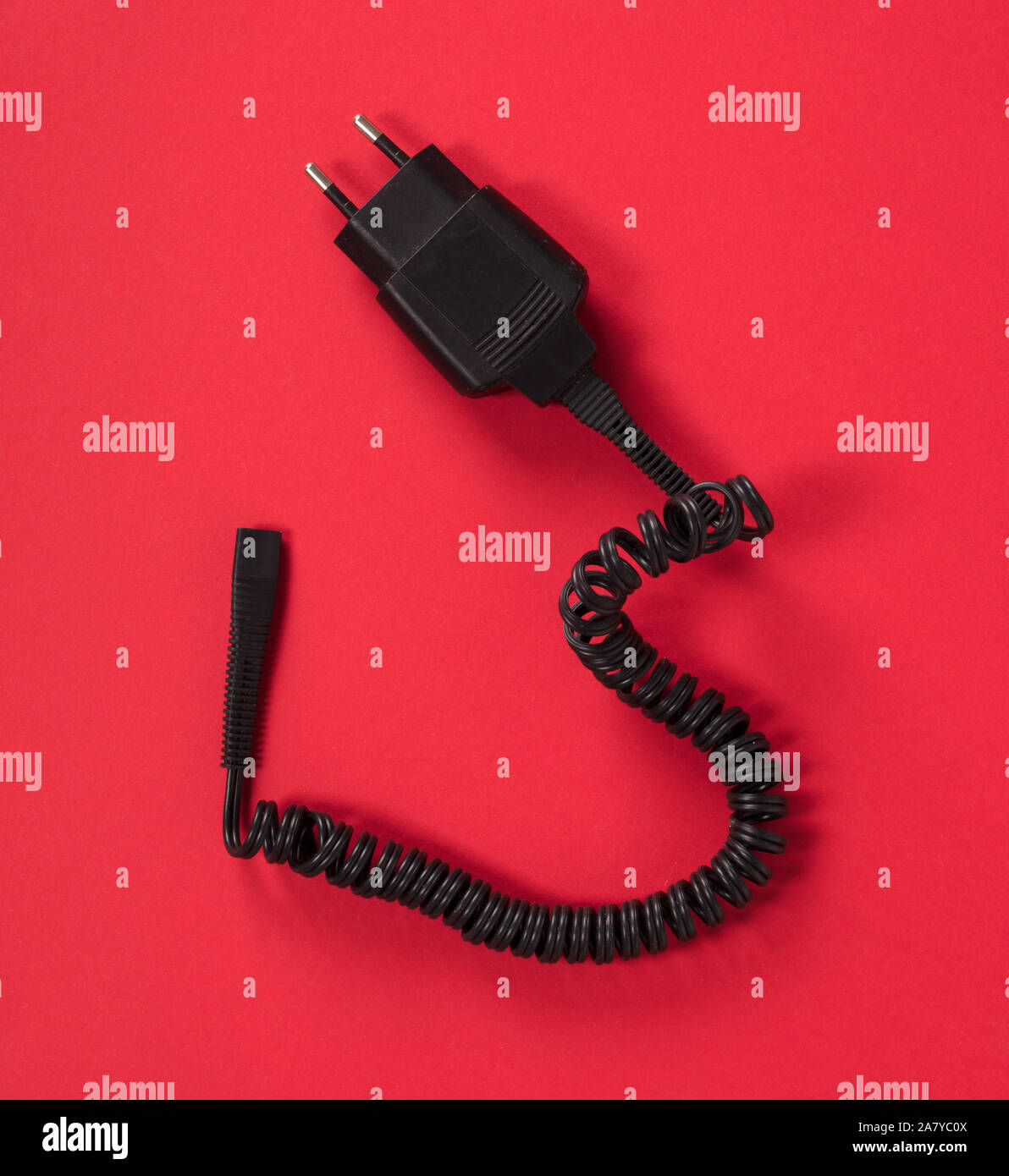 Black charger (220v) isolated on a red background Stock Photo Alamy