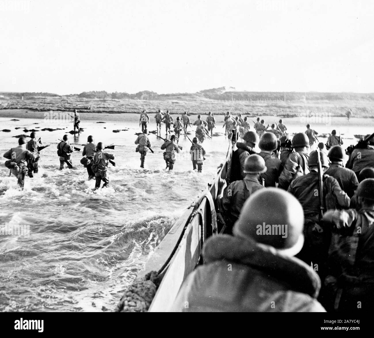 Marines wade thru surf to help with occupation of Japan - possibly oct 15 1945 Stock Photo