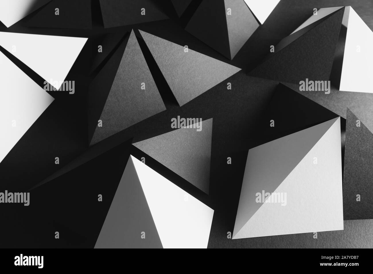 Pyramidal shapes of paper for dark background, abstract Stock Photo - Alamy