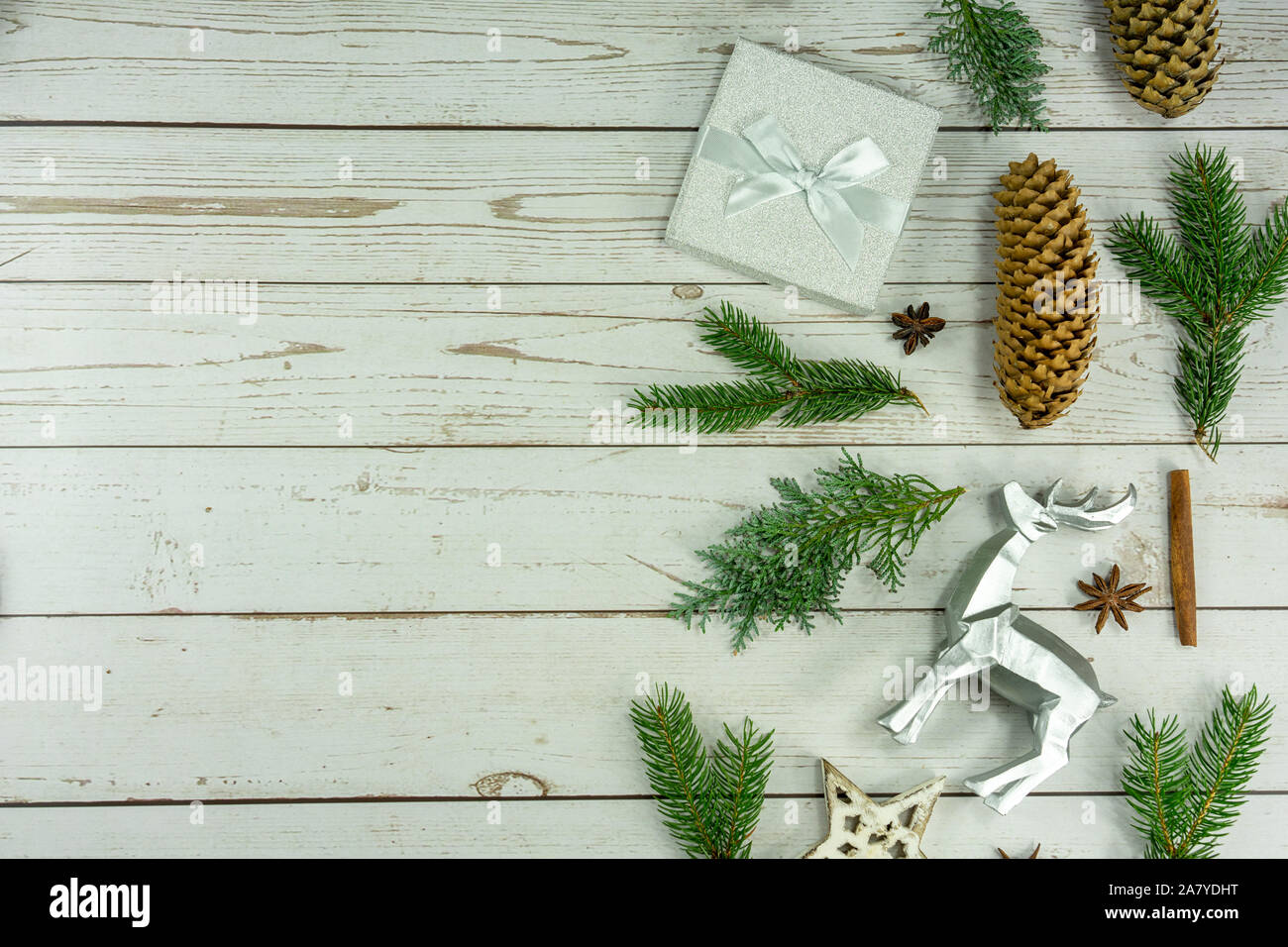 flat lay christmas composition on white wooden background natural with silver details . Stock Photo