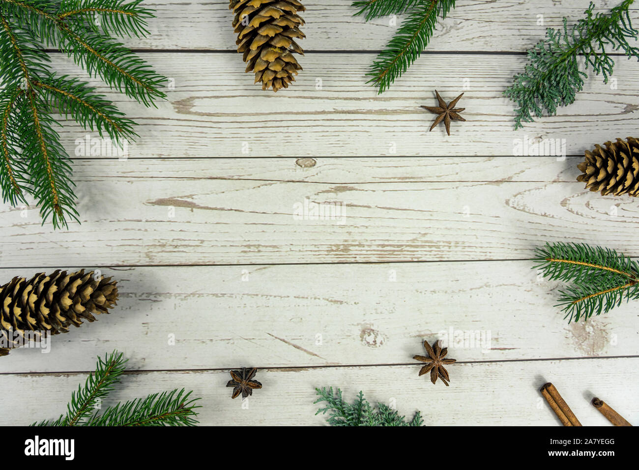 Christmas frame background flat lay on white wood with other natural decoration . Stock Photo