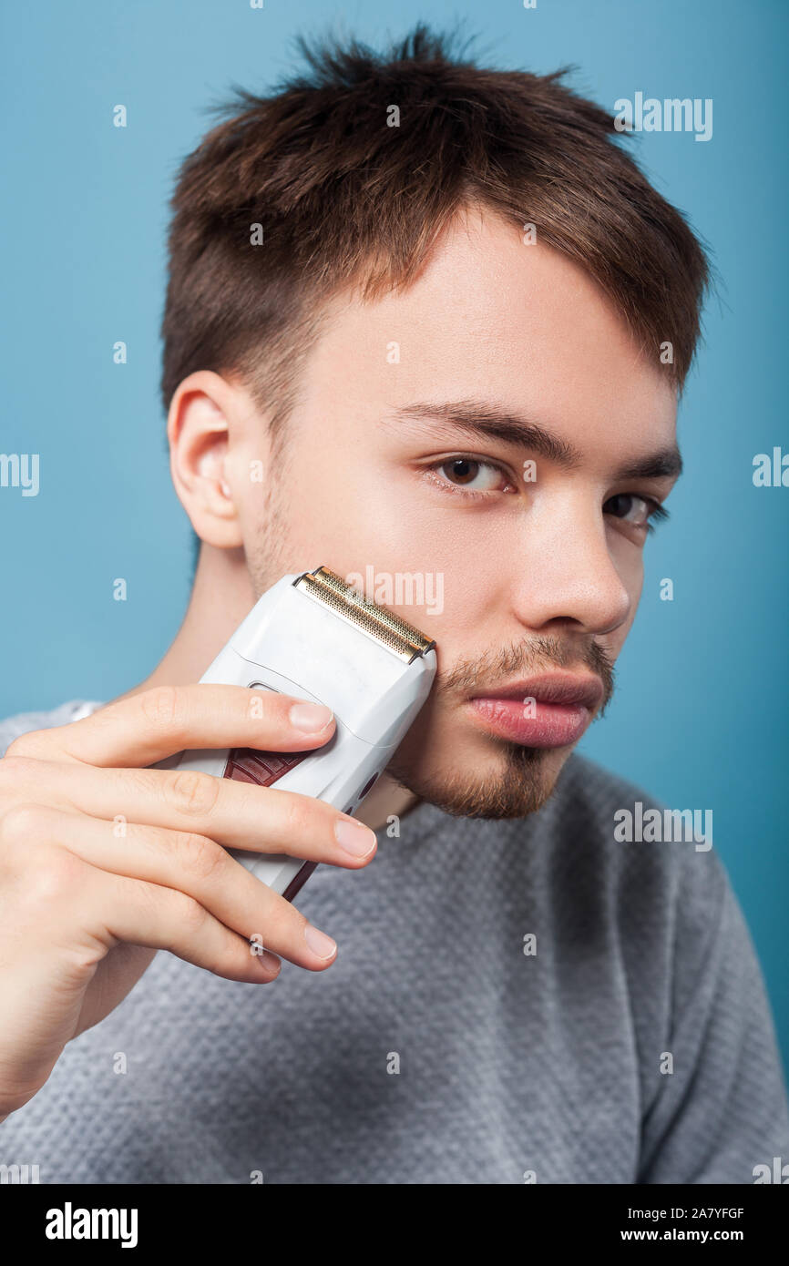 Portrait Of Handsome Brunette Man With Bristle And Mustache In