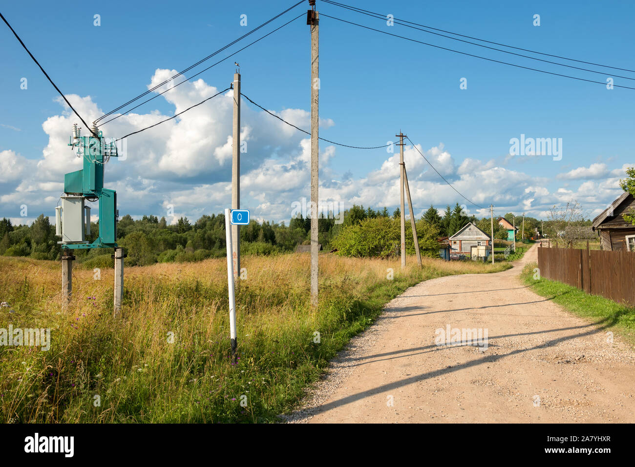 Electricity transformer substation mounted on the side of a country
