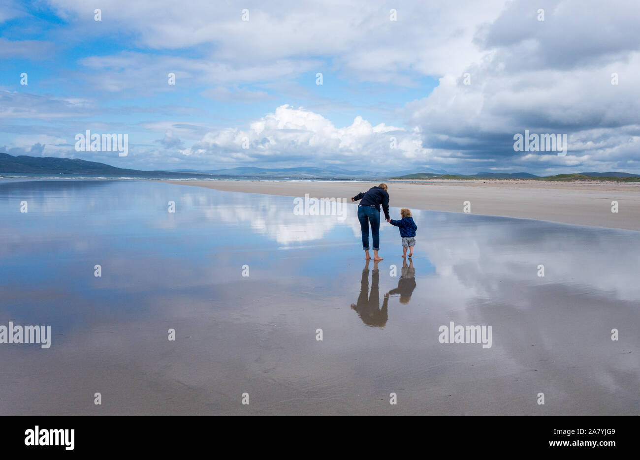 Mother and daughter walking on the scenic Narin Beach Portnoo County Donegal Ireland Stock Photo
