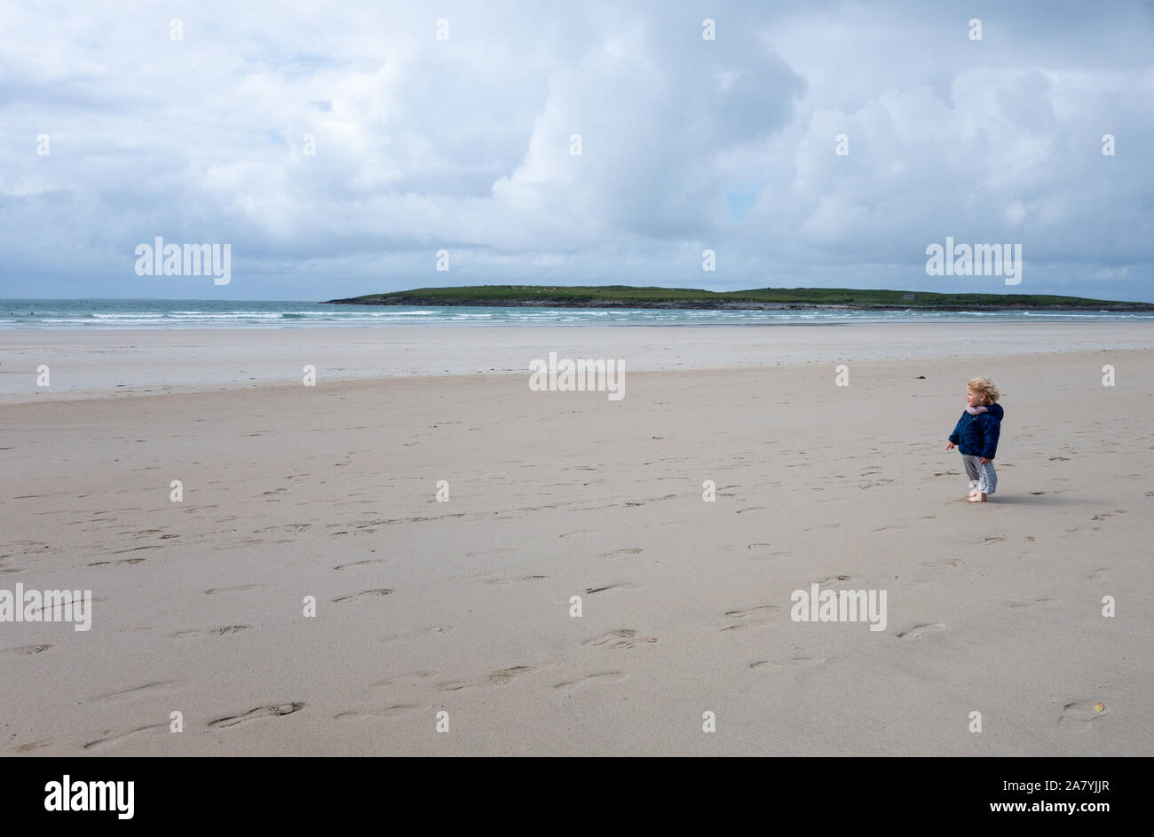 Young girl toddler walking on the scenic Narin Beach Portnoo County Donegal Ireland Stock Photo