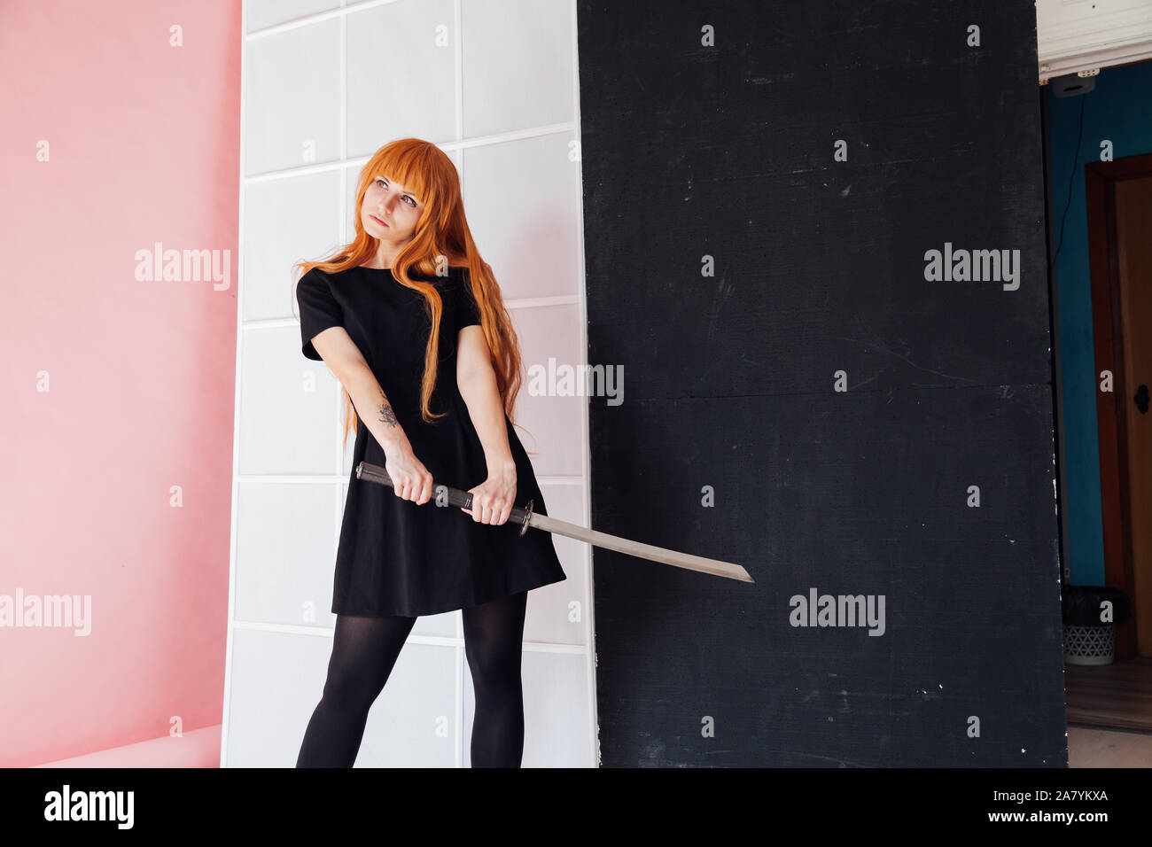 Fashionable Woman With Red Hair Anime Japan Sword Stock Photo