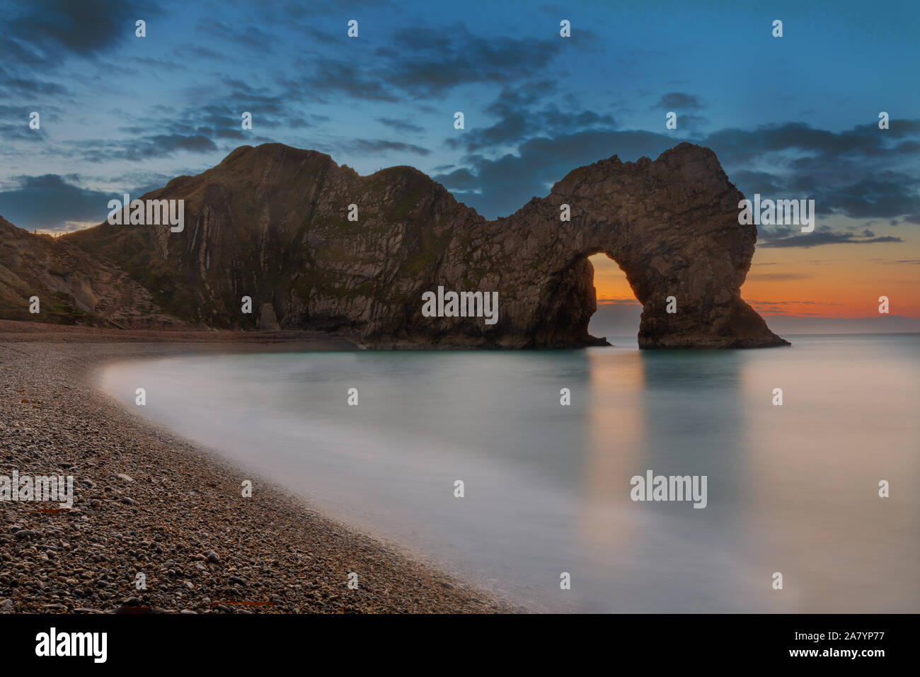 Durdle Door Dorset England Dawn at Durdle Door, an amzing natural, limestone arch, and one of the most famous parts of Dorset's Jurassic coast. Stock Photo