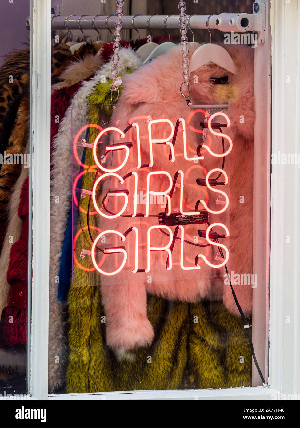 Girls Girls Girls neon sign on a woman's clothes shop in Cheshire Street near fashionable Brick Lane in East London Stock Photo