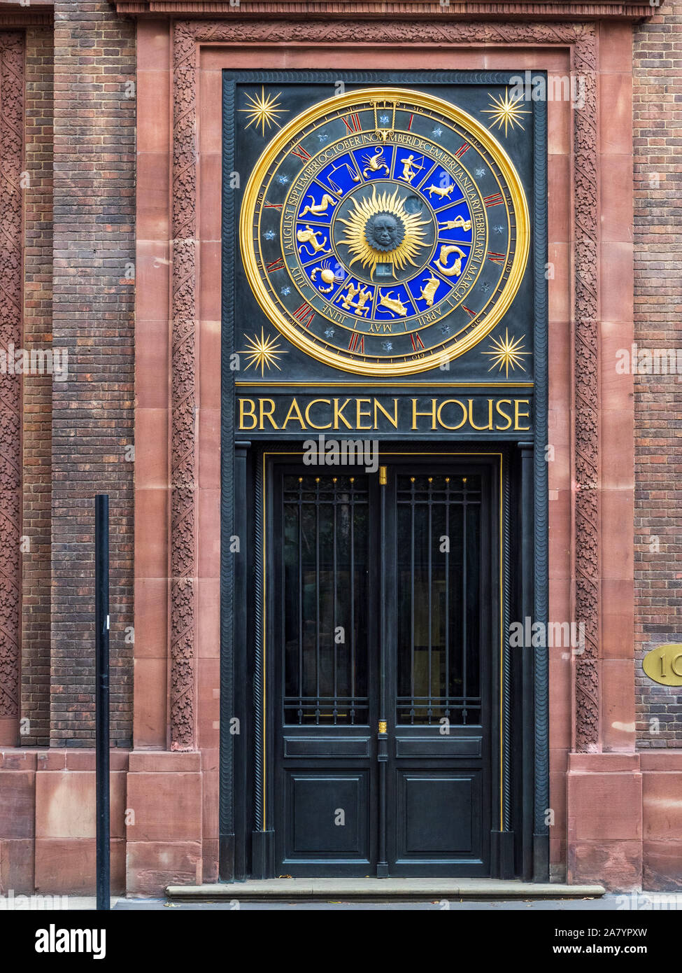 Astronomical clock on the FT Financial Times HQ at refurbished Bracken House in the City of London. Designers Frank Dobson and Philip Bentham Stock Photo