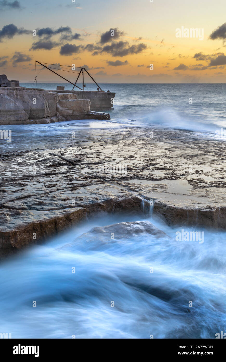 Portland Bill Dorset England Waves breaking on the rocks at Portland Bill, at low tide during stormy weather. Stock Photo