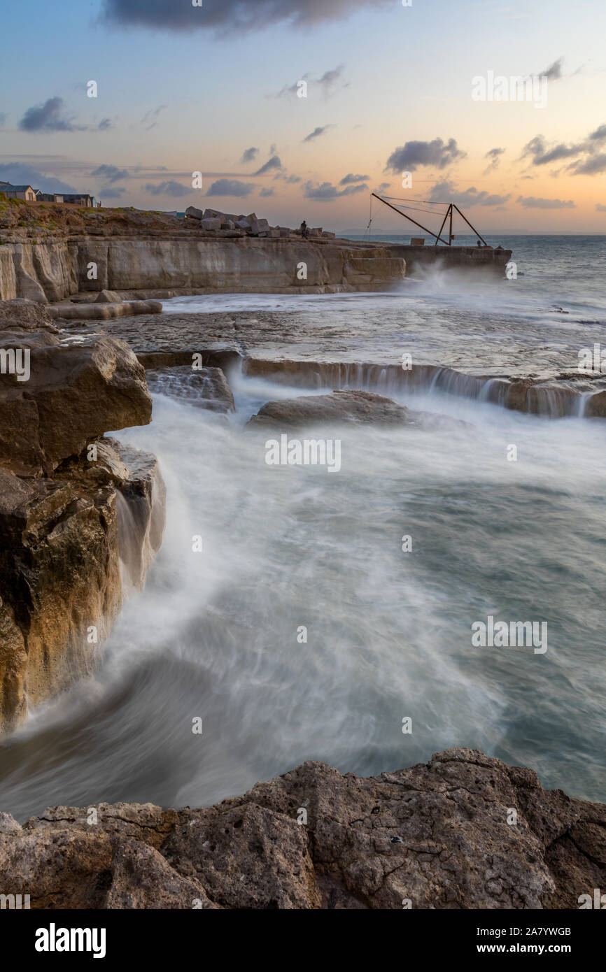 Portland Bill Dorset England Waves breaking on the rocks at Portland Bill, at low tide during stormy weather. Stock Photo