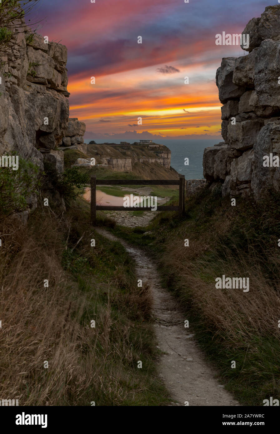 Portland Dorset England Beautiful sunset seen from the South West Coast Path, showing the dramatic cliff scenery of the west coast of Portland Stock Photo