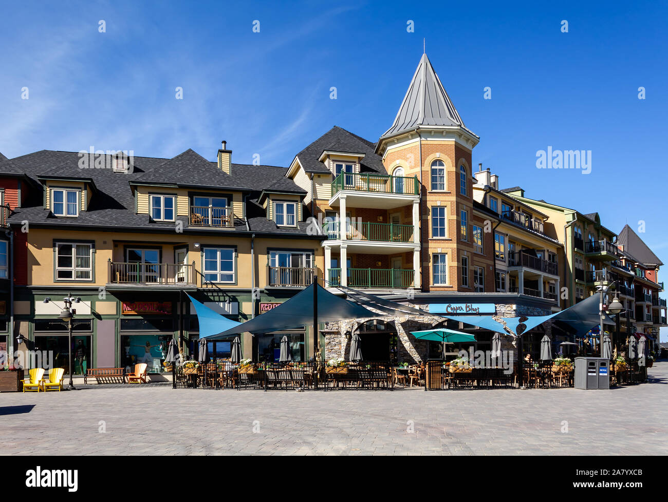 COLLINGWOOD, ON, CANADA - September 30, 2018: Shops and restaurants on pedestrian street at Blue Mountain Village in Autumn. Stock Photo