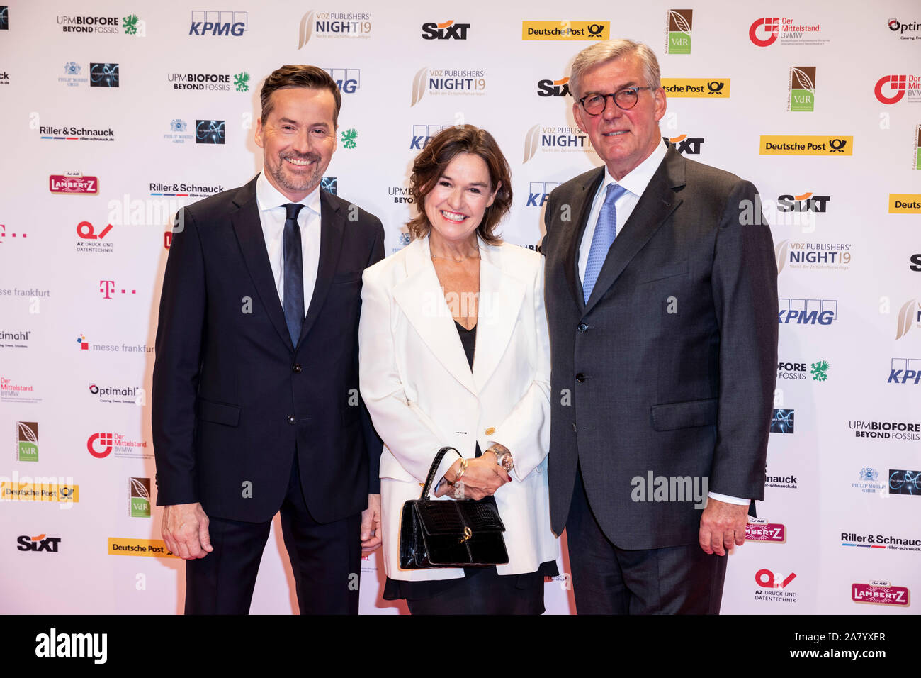 Berlin, Germany. 04th Nov, 2019. Stephan Scherzer (l), Managing Director of VDZ, Rudolf Thiemann (r), President of VDZ, and his wife Virginia Thiemann, will attend the 'VDZ Publishers' Night 2019 - Gala of Magazine Publishers' at Deutsche Telekom's Capital Representative Office. President of the Bundestag Schäuble is awarded the 'Honorary Victoria' and Reporters Without Borders the 'Golden Victoria 2019 for Press Freedom'. VDZ Publishers' Summit and Gala form the largest network event of the Association of German Magazine Publishers (VDZ). Credit: Christoph Soeder/dpa/Alamy Live News Stock Photo