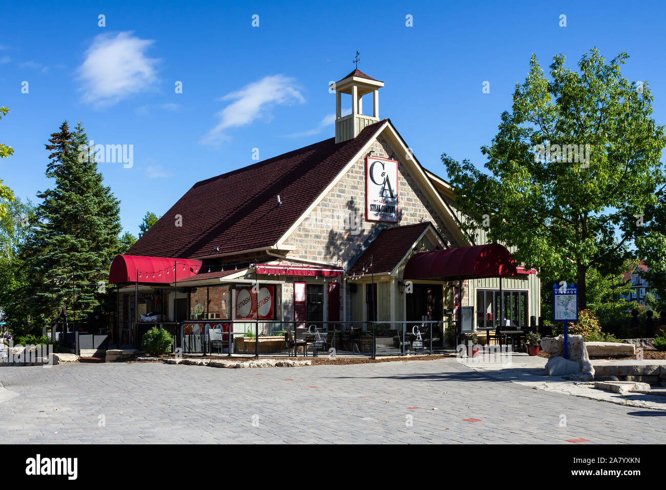 COLLINGWOOD, ON, CANADA - September 30, 2018: Shops and restaurants on pedestrian street at Blue Mountain Village in Autumn. Stock Photo