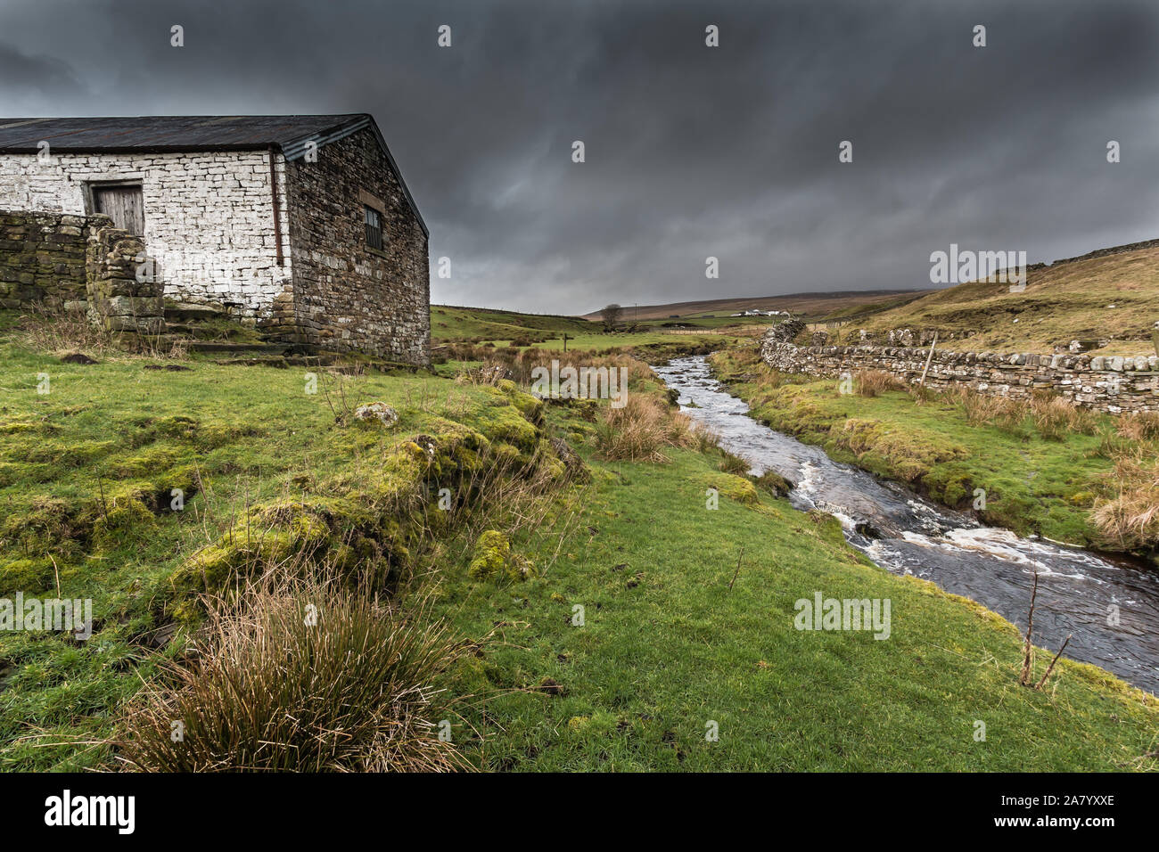 The remote and bleak hill farm at High Beck Head, Upper Teesdale, UK Stock Photo