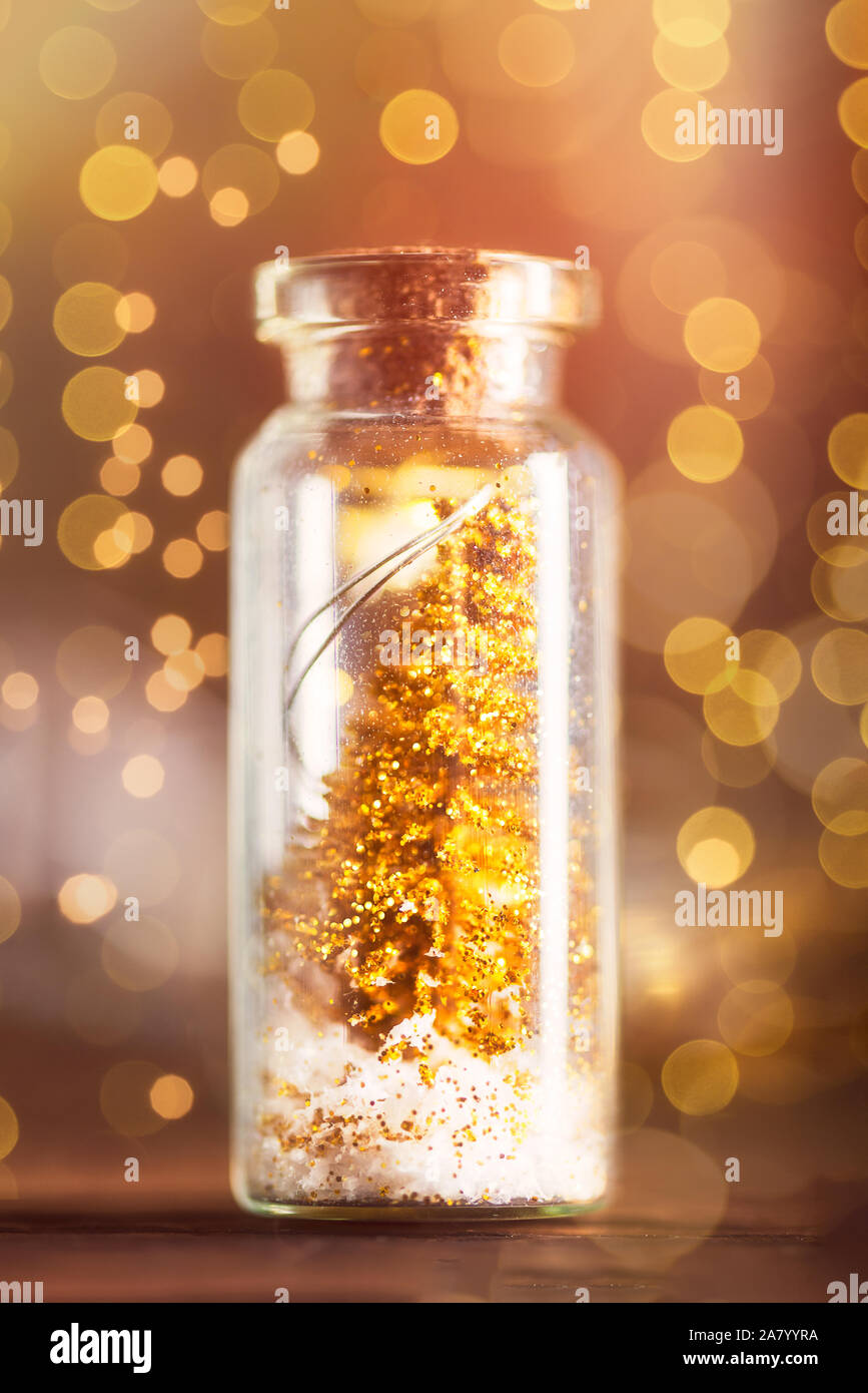 Miniature Gold Christmas Trees in Glass Baubles, which are in the form