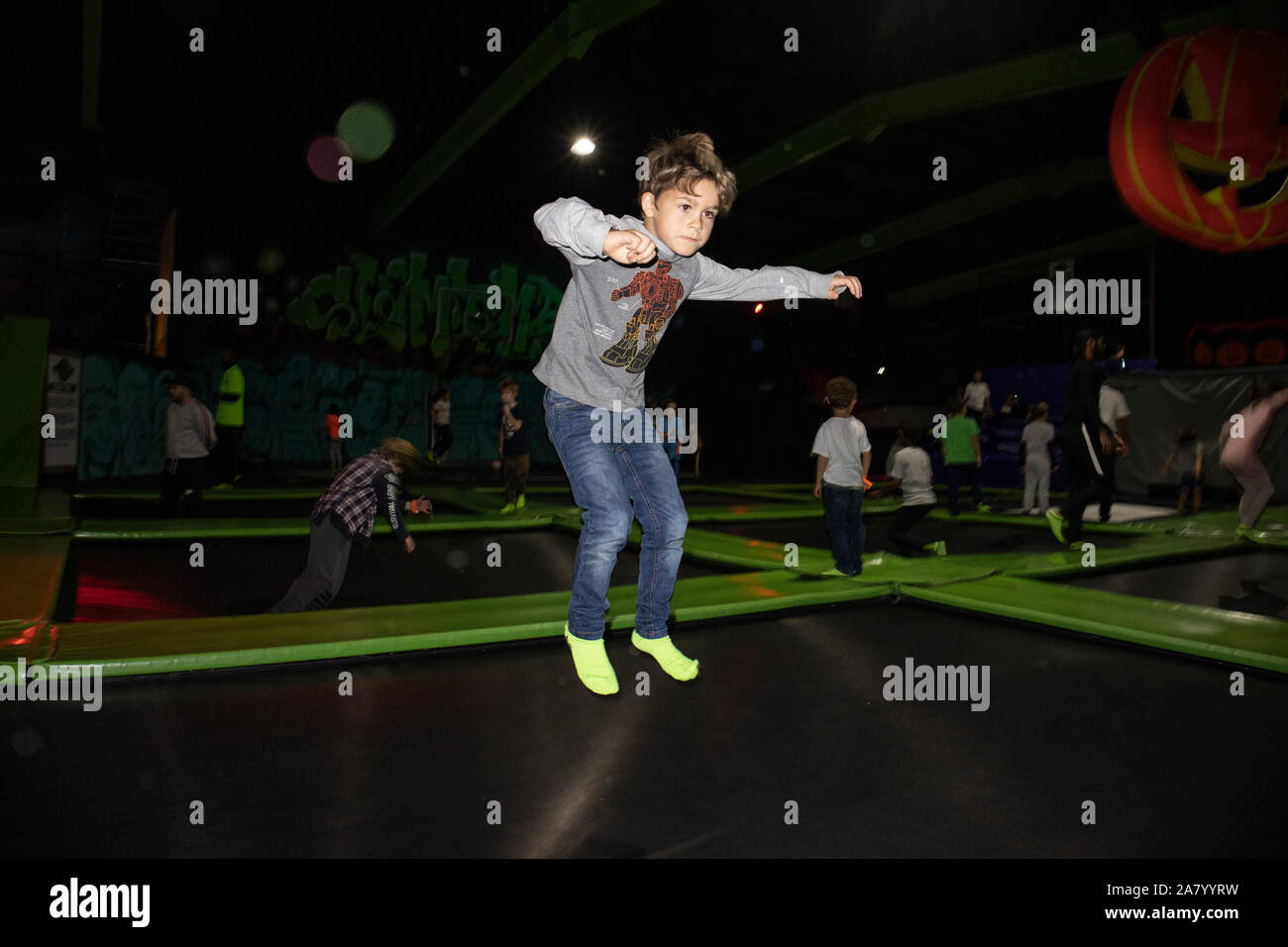 6 year old boy bouncing on a trampoline at 'Flip Out London', situated in  Wandsworth, London's biggest trampoline park, England, UK Stock Photo -  Alamy